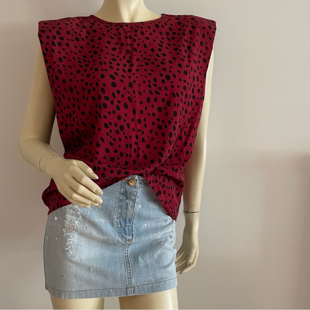 sleeveless blouse with shoulder pads and animal print